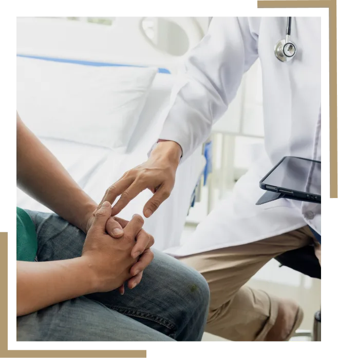 A physician consulting with a patient in an exam room